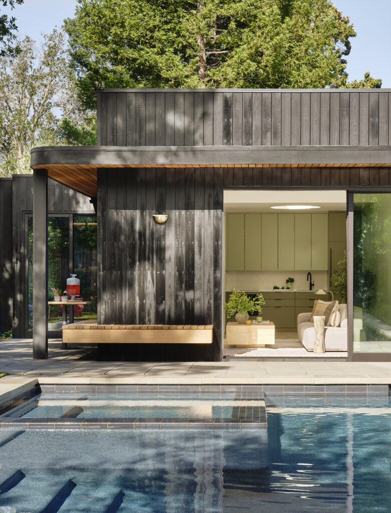 Backyard retreat with aligned pool and shaded ADU structure designed for gathering and relaxation in Lafayette.