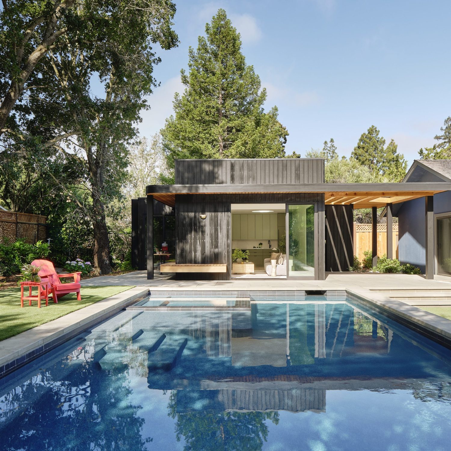 The new ADU and pool are designed in quiet conversation—sun for the swim, shade for the rest